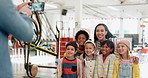 Photo, happy and a woman with children at a science fair for a memory, school exhibition or learning. Smile, together and a teacher with kids or students taking a picture at a museum for education