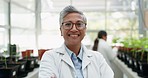 Face, science and woman with arms crossed in greenhouse for botany research. Scientist portrait, mature medical professional and confident doctor in agriculture, happy and smile with glasses at farm