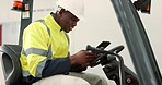 Tablet, forklift and engineering with black man in warehouse for project management, search or construction. Industrial, manufacturing or digital with person in factory for architecture and planning