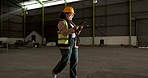 Industry, tablet and woman construction worker in warehouse for industrial engineering project. Contractor, digital technology and female engineer doing online research by an indoor site for storage.