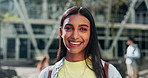 Face, woman and student smile at college for education, learning and knowledge at campus building. Portrait of young gen z indian girl studying at academy, university and pride for scholarship degree