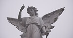 Funeral, cemetery and angel on tombstone for death ceremony, religion or memorial service. Statue symbol, background or Christian sign on gravestone for mourning, burial or loss in public graveyard