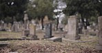 Graveyard, burial and tombstone in cemetery for death ceremony, funeral ritual and memorial service. Headstone, rip and resting place of departed for mourning, loss and remembrance of dead by church