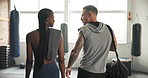 Man, woman and fitness in gym, talking and back for exercise, wellness and diversity for training partner. Personal trainer, coaching or mentorship in conversation, advice or communication for health