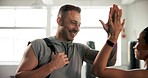 Gym, people and high five to celebrate fitness or start exercise, sports training or workout for wellness. Man and woman athlete friends at health club for success, challenge or personal trainer talk