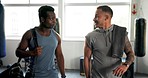 Gym, friends and talking of exercise, sports training or workout for wellness. Athlete men at health club for fitness, conversation and commitment or bodybuilder advice with personal trainer