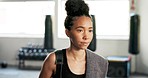 Woman leaving, fitness and walking in gym after exercise, workout and training at wellness club. Bag, sweat towel and female athlete thinking and relax at health studio done with a sports class