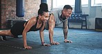 Happy man, woman and push up for gym workout, training and team exercise on floor in health club. Diversity, strong friends and bodybuilding challenge with fitness partner for action, muscle or power