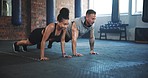 Man, woman and push up for gym exercise, training and team workout together on ground. Diversity, friends and performance challenge for fitness, strong core and bodybuilding power in wellness club 