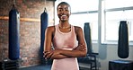 Smile, face and a black woman with arms crossed at the gym for fitness, sports or a workout. Happy, portrait and an African person or athlete with confidence in exercise, training or cardio at a club