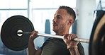 Man, barbell and press exercise in gym for workout, functional training or muscle strength in fitness club. Serious bodybuilder, heavy weightlifting and challenge of strong power, endurance or energy