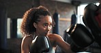 Boxer, sports and woman punch training, cardio support and practice power impact, MMA challenge or kickboxing hard work. Action, fighter gloves and learning boxing, self defense or partner workout