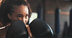 Sports, woman face and boxer punch training, fist impact challenge and practice power, cardio fitness or exercise. Action, fighter gloves and strong athlete boxing, self defense or determined workout
