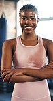 Fitness, happy and face of black woman in gym with crossed arms for training, exercise and workout. Sports club, personal trainer and portrait of confident person for challenge, wellness and health