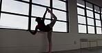 Dance, silhouette and a black woman stretching for ballet while getting ready for training, recital or rehearsal. Exercise, creative and warm up with a ballerina in an artistic studio for expression