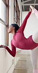 Dance, balance and a black woman stretching for ballet while getting ready for training, recital or rehearsal. Fitness, creative and warm up with a ballerina in a performance studio for expression