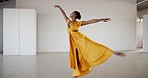 Dance, woman and ballet performance in creative art studio with energy and passion. Professional African dancer practice for theater, ballerina and freedom with balance, dress and talent or wellness