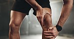 Fitness, knee pain and hands of man at gym for training with muscle, problem or arthritis. Sports, injury and leg of male athlete with joint massage for fibromyalgia, osteoporosis or bone accident