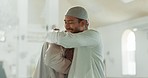 Muslim, greeting and people hug in mosque for community, support and hello for Islamic leader. Holy temple, prayer and men in religious building for Ramadan Kareem, Eid Mubarak and praying together