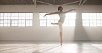 Dance, ballet and energy with woman in studio for performance, theater or creative academy Health, music and freedom with elegant ballerina training in class for wellness, practice routine or balance