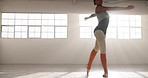 Dance, ballet and performance with woman in studio for art, theater and creative academy Health, music and freedom with elegant ballerina training in class for wellness, practice routine and balance