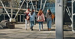 University, back view and students walking on campus for education together for lunch break as friends with scholarship. Learning, diversity and people in conversation happy in college or school