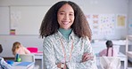 Female teacher, arms crossed and smile in class with school kids, pride or happy for education career. Woman, classroom and learning expert for children, face or portrait with development for future