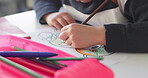 Creativity, school and hands of child drawing in a classroom for art lesson for education and development in class. Closeup, kindergarten and kid or student learning artistic homework on a desk