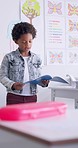 Child, reading and classroom speech with kid speaker, book and education at a school. Students, learning and notebook with development, knowledge and study with story discussion of youth assessment