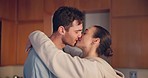 Couple, kiss and hug in home, love and intimate romance with care, bonding and happy for connection. Young man, woman and together with embrace, marriage or anniversary with profile, date and house