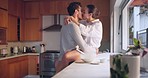 Kiss, love or couple in kitchen for romance, care or bonding together with an intimate connection. Man, woman and romantic people hug in celebration of marriage anniversary in the morning at home