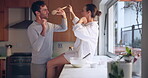 Singing, love or happy couple in house kitchen bonding together for a fun memory on holiday vacation. Cooking, woman or man dancing in celebration of marriage anniversary in the morning to relax