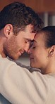 Forehead, care or happy couple hug in kitchen for romance, love or bond together in an intimate connection. Eye contact, man or romantic woman in embrace to celebrate marriage anniversary at home