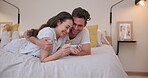 Family, bed and pregnancy test with a couple hugging in celebration of good news together in their home. Love, pregnant or maternity with a man and woman in the bedroom happy at a positive result