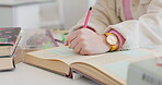 Hands, writing in notebook and student studying, learning and research knowledge of info. Closeup, notes and person on diary, journal or planning schedule reminder in to do list for education idea