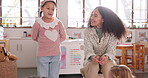 Teacher, student or child for presentation in elementary classroom, learning and education. Front, woman and kid talking in class to speak to audience for assessment, speech or development at school
