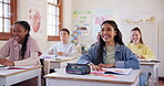 Education, smile and student friends laughing in class while learning during an academic lesson together. School, study and happy with kids in a classroom for scholarship, growth or child development