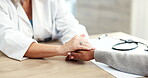 Doctor, patient and holding hands for healthcare consultation with advice, support or empathy. Medical worker and woman at hospital for conversation with compassion, diagnosis and trust or help