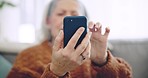 Phone, hand and closeup of senior woman scroll on social media, mobile app or the internet. Technology, communication and elderly female person browsing on a website for research on cellphone at home