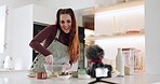 Kitchen, video camera and influencer cooking, woman streaming and broadcast nutrition food, home recipe or clean eating. Talking nutritionist, content creator communication and chef record media vlog