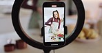 Influencer woman, cooking and phone screen for recording, ring light or live stream for web tutorial in house. Girl, chef and smartphone in home kitchen, video and stir bowl for food on social media