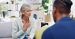 Sick old woman, talking or consulting a nurse writing notes for healthcare service of therapy or counseling. Chest pain, throat cancer or elderly patient speaking or explaining illness symptoms