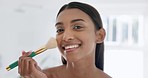 Makeup, cosmetic and face of woman in the bathroom for glamour, natural or facial routine in mirror. Cosmetology, brush and portrait of Indian female person doing beauty treatment in modern apartment