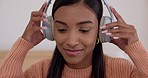 Headphones, music and happy woman listening to podcast audio or radio in a home to relax or streaming a song. Sound, album and happy young person enjoy hearing multimedia subscription in a house