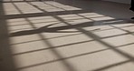 Floor, shadow or dancer in studio light for movement, routine or creative stage art for theatre, performance or ballet. Person, dancing or ballerina on ground for practice, balance and elegant motion