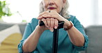 Hands, cane and senior woman with walking stick for balance, retirement and mobility support on a couch or sofa. Closeup, Aid and elderly person with disability, dementia or chronic arthritis