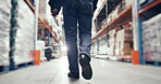 Back, man and walking in warehouse for storage, distribution and wholesale production. Closeup, factory worker and footsteps of supply chain technician in inspection, logistics or industrial shipping