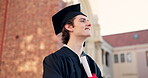 Happy man, student and graduate thinking in scholarship or career ambition at outdoor campus. Male person smile in graduation with diploma, certificate or degree for dream, goal or academic milestone