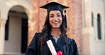 Happy woman, student and graduation, scholarship or career ambition in success at campus. Portrait of female person or graduate smile in higher education for certificate, degree or diploma at college