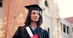 Happy woman, student and graduate thinking in scholarship or career ambition at campus. Female person smile in graduation with diploma, certificate or degree for dream, goal or academic milestone